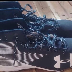 Men’s size 13 football under armor  cleats they are new to small for my son